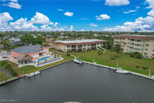 birds eye view of property with a water view