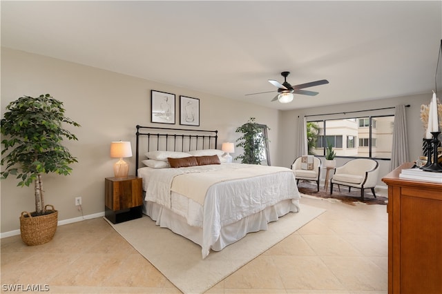 bedroom featuring ceiling fan and light tile floors