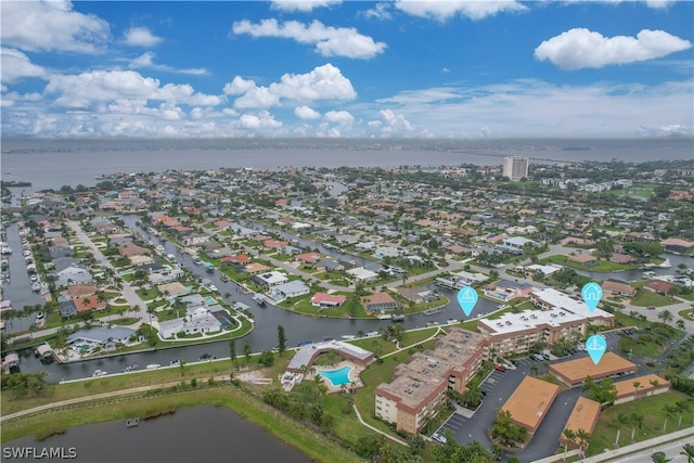 birds eye view of property with a water view