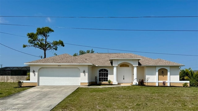 single story home with a front yard and a garage