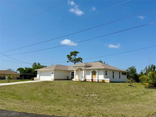 ranch-style house with a garage and a front lawn