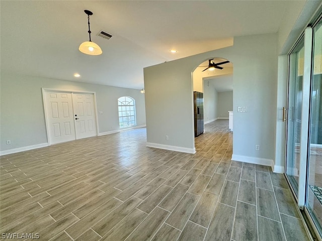 unfurnished room with ceiling fan and light hardwood / wood-style flooring