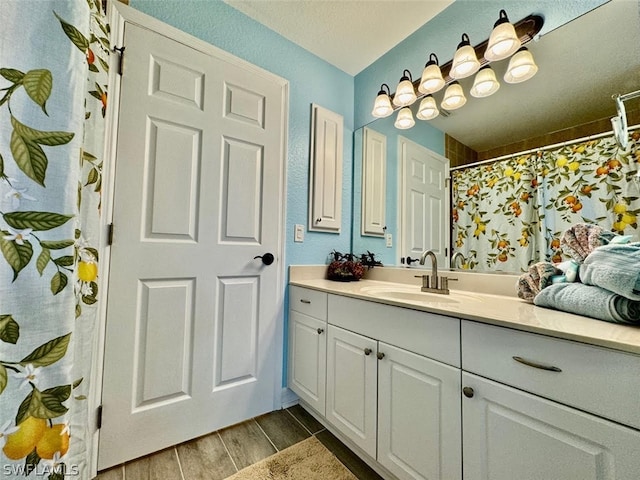 bathroom featuring hardwood / wood-style flooring and vanity