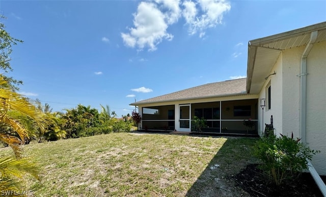 view of yard featuring a sunroom