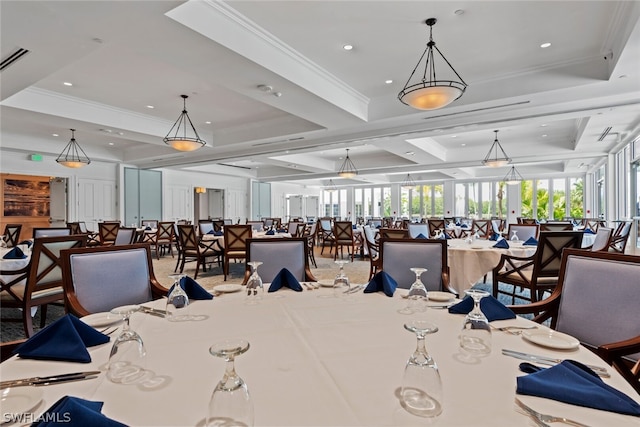 dining room with crown molding and a tray ceiling