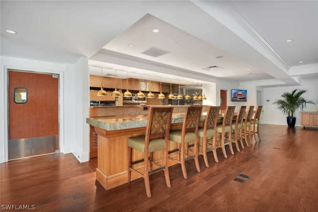 bar featuring dark wood-type flooring