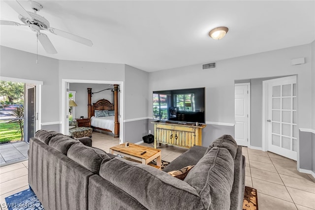 tiled living room featuring ceiling fan