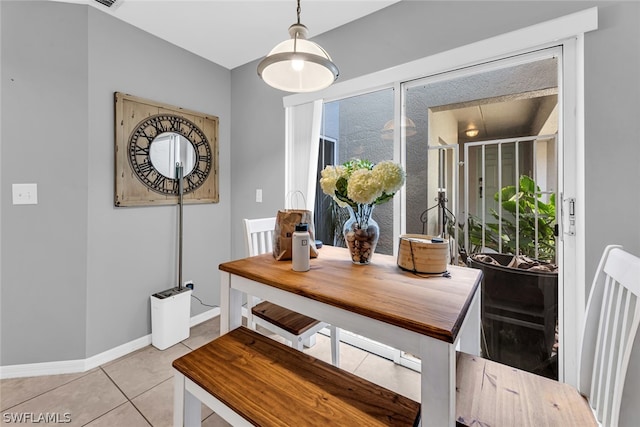 dining room featuring light tile floors