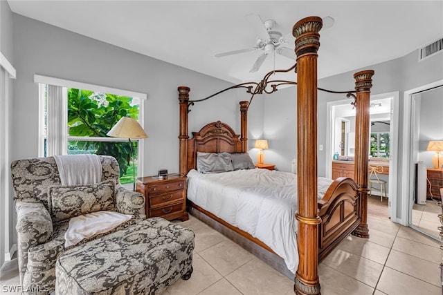 tiled bedroom featuring ceiling fan and multiple windows