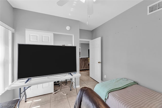 tiled bedroom with ceiling fan