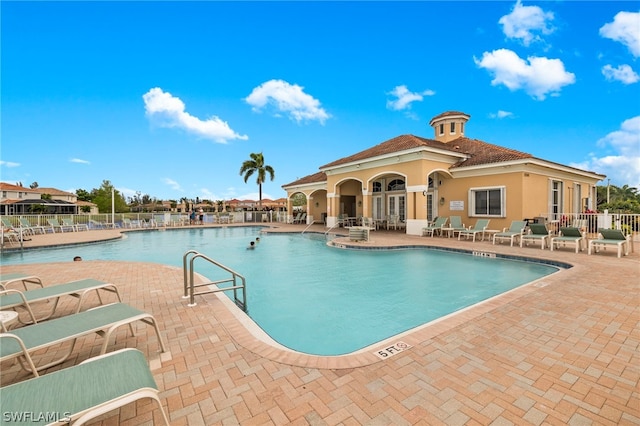 view of swimming pool with a patio area