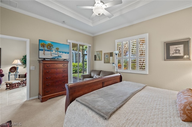 bedroom featuring a tray ceiling, light colored carpet, ceiling fan, access to outside, and ornamental molding