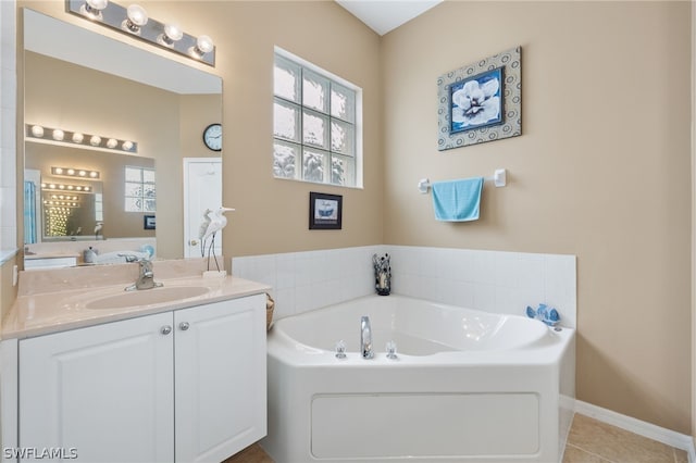 bathroom with tile floors, a bathtub, and vanity with extensive cabinet space