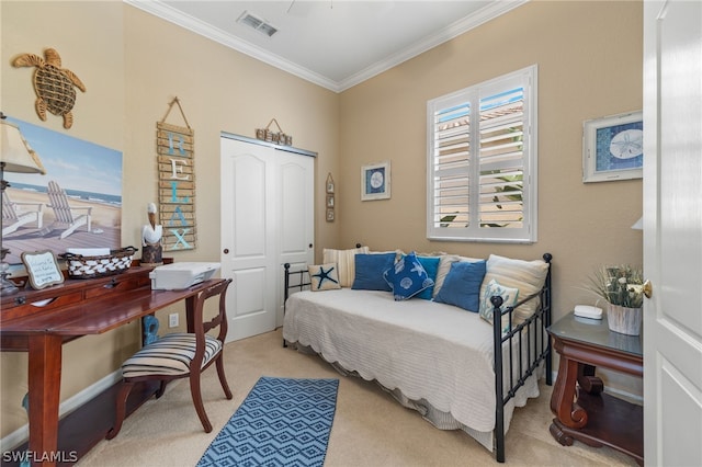 bedroom with light colored carpet, a closet, and crown molding