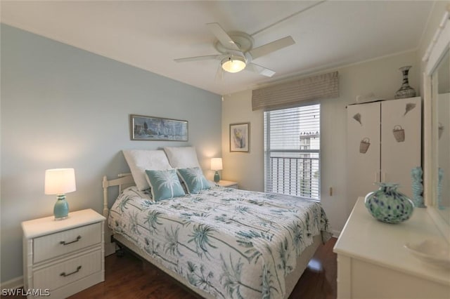 bedroom featuring ceiling fan and dark hardwood / wood-style floors