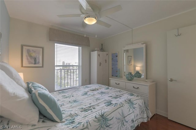 bedroom with ceiling fan and dark wood-type flooring