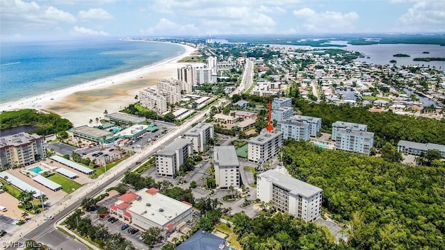 birds eye view of property featuring a water view and a view of the beach