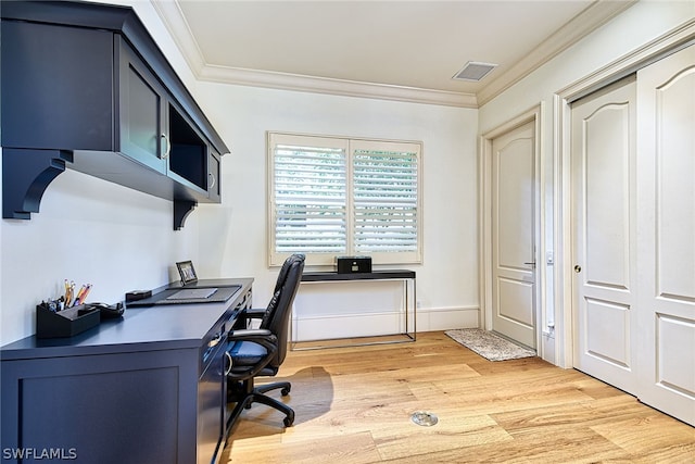 office with crown molding and light hardwood / wood-style floors