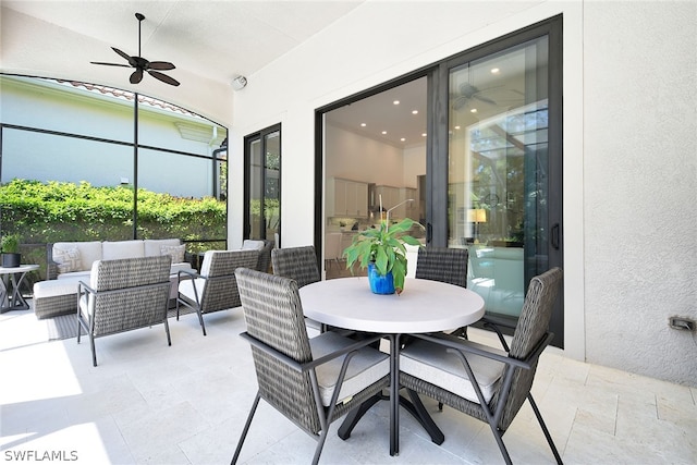 view of terrace with ceiling fan and an outdoor hangout area