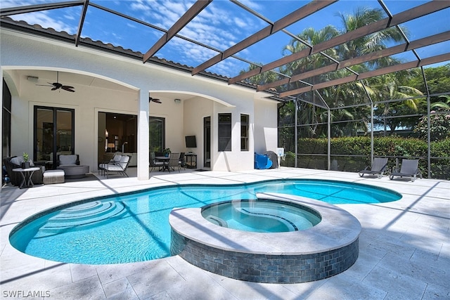 view of swimming pool featuring ceiling fan, a lanai, a patio, and an in ground hot tub