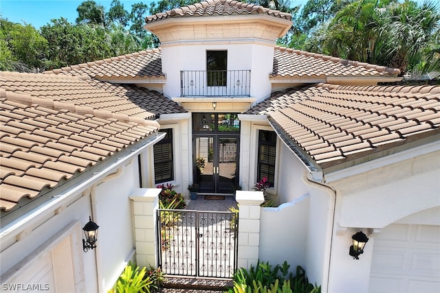 mediterranean / spanish home featuring a garage