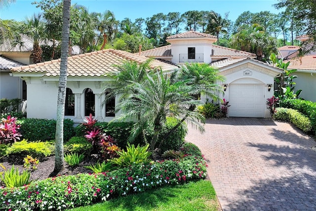 mediterranean / spanish-style home featuring a garage