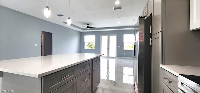 kitchen with marble finish floor, visible vents, stainless steel refrigerator with ice dispenser, and gray cabinetry