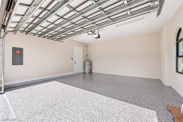 garage with water heater and a garage door opener