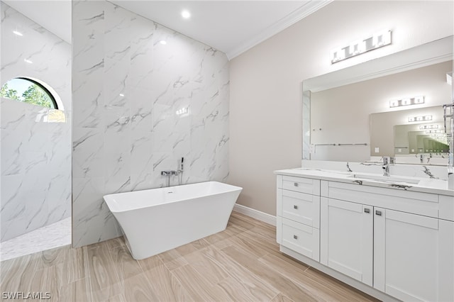 bathroom with tile walls, a bath to relax in, crown molding, tile flooring, and vanity