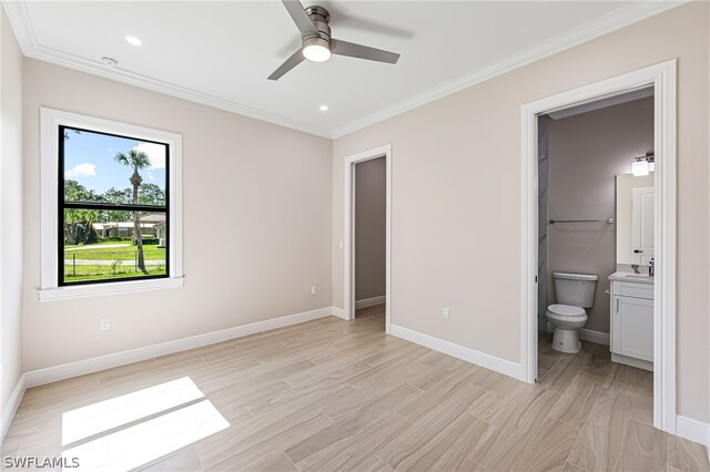 unfurnished bedroom featuring connected bathroom, ceiling fan, and crown molding