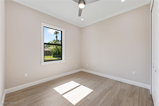 empty room with light hardwood / wood-style floors, crown molding, and ceiling fan