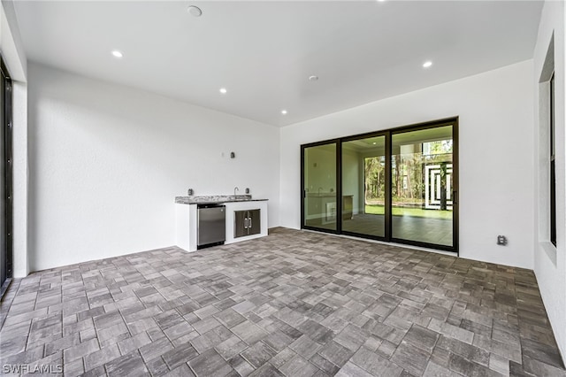 unfurnished living room with tile floors