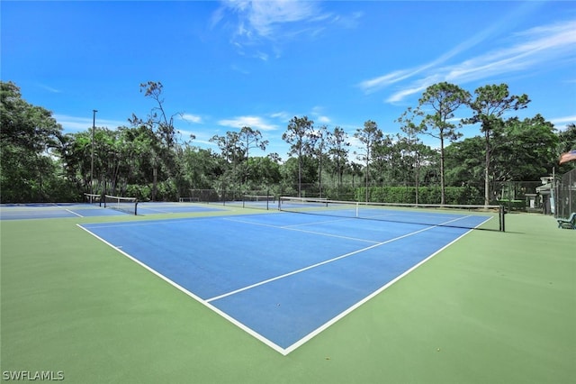 view of sport court with basketball hoop