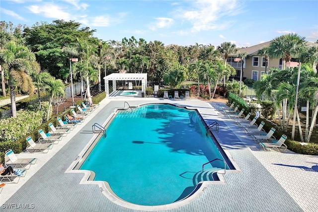 view of swimming pool with a pergola and a patio area