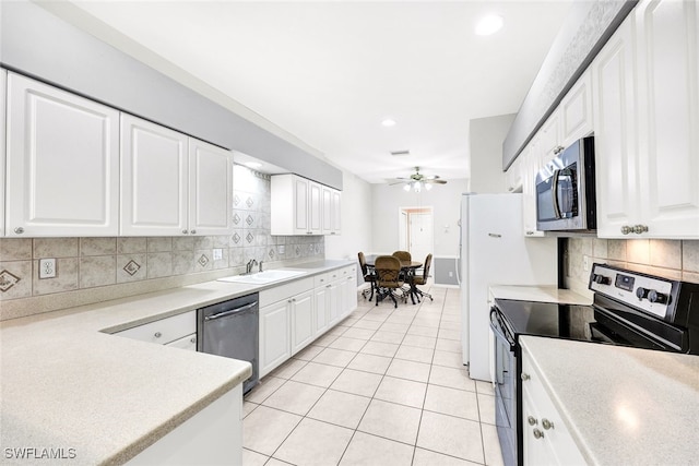 kitchen with ceiling fan, white cabinets, light tile patterned floors, and appliances with stainless steel finishes