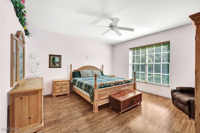 bedroom featuring ceiling fan and wood-type flooring