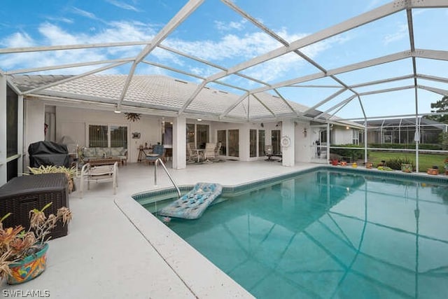 view of pool with area for grilling, an outdoor living space, a patio, and glass enclosure