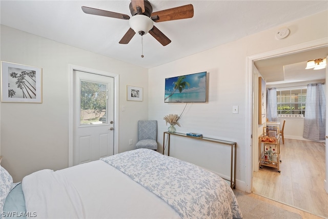 bedroom with ceiling fan and light hardwood / wood-style floors