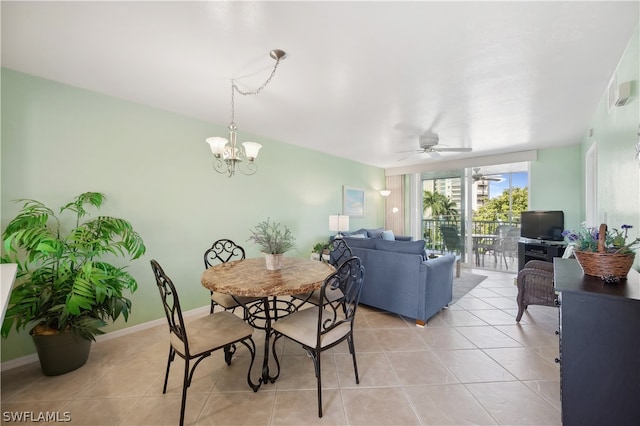 dining space featuring light tile floors and ceiling fan with notable chandelier