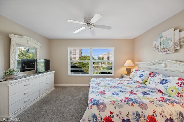 carpeted bedroom featuring multiple windows and ceiling fan