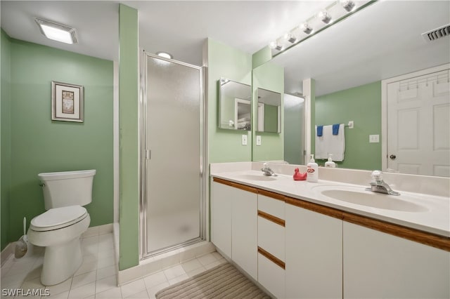 bathroom featuring walk in shower, tile floors, double sink, large vanity, and toilet