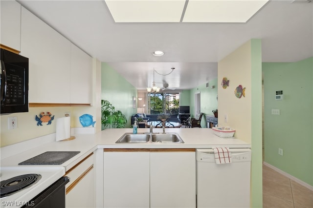 kitchen with an inviting chandelier, light tile flooring, sink, white dishwasher, and white cabinetry