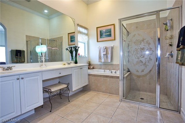 bathroom featuring tile patterned flooring, vanity, crown molding, and plus walk in shower