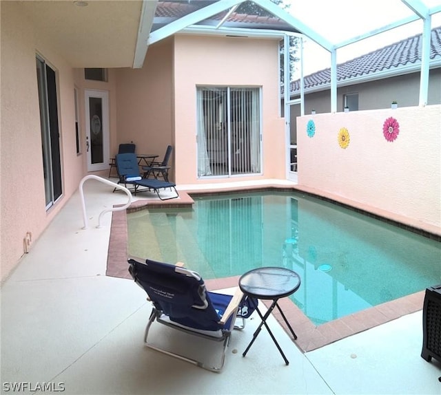 view of pool featuring a lanai and a patio