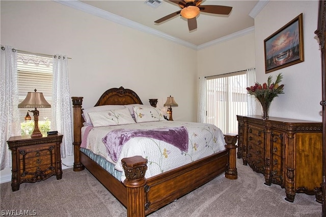 bedroom featuring ceiling fan, ornamental molding, and light carpet