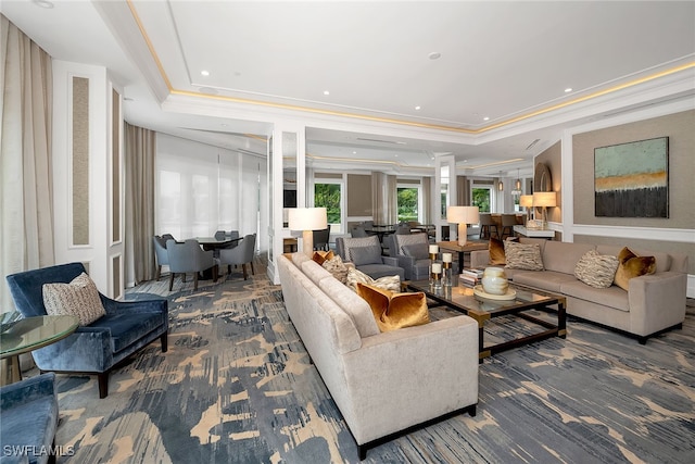 living room featuring recessed lighting, a raised ceiling, carpet, and ornamental molding