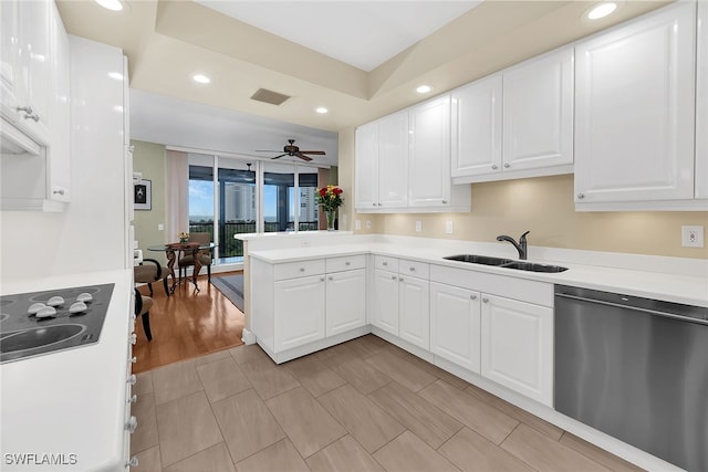 kitchen with light hardwood / wood-style floors, white cabinetry, sink, ceiling fan, and stainless steel dishwasher