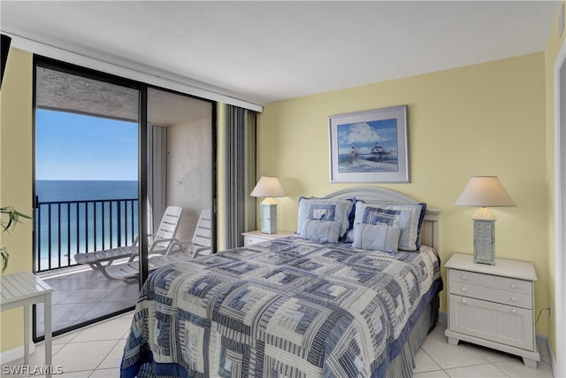 tiled bedroom featuring a water view