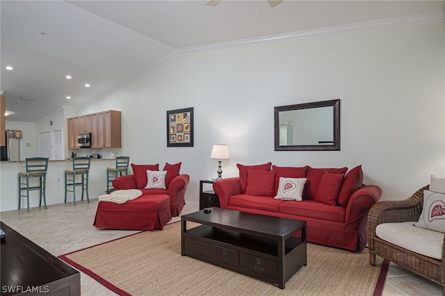 tiled living room with ornamental molding, vaulted ceiling, and ceiling fan