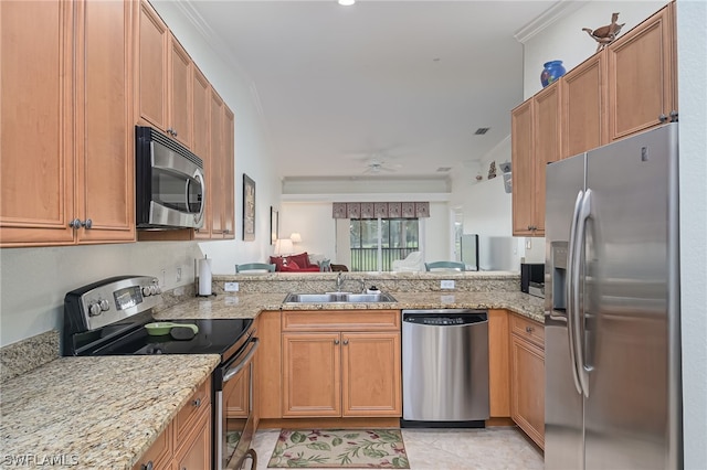 kitchen with kitchen peninsula, stainless steel appliances, light tile floors, and sink